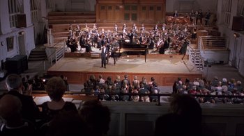 Movie still from “Shine” (1996), directed by Scott Hicks – A large crowd of people watching a concert; Extreme Wide shot, High angle