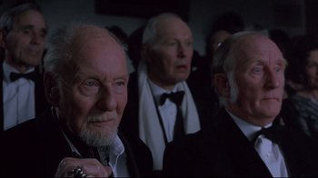 Movie still from “Shine” (1996), directed by Scott Hicks – A group of older men in suits and ties; Close Up shot, Low angle