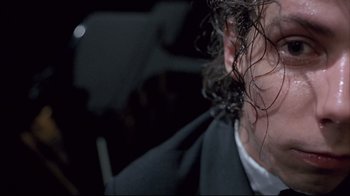 Movie still from “Shine” (1996), directed by Scott Hicks – A person with long hair; Extreme Close Up shot, Low angle