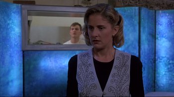 Movie still from “Shine” (1996), directed by Scott Hicks – A woman standing in front of a man in a mirror; Medium shot, Over the shoulder angle