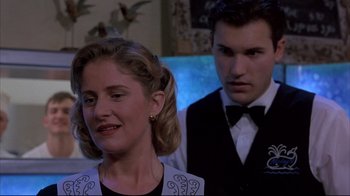 Movie still from “Shine” (1996), directed by Scott Hicks – A man and a woman standing next to each other; Close Up shot, Over the shoulder angle