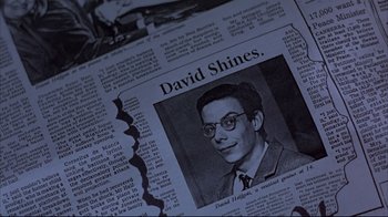 Movie still from “Shine” (1996), directed by Scott Hicks – A newspaper article with a picture of a man; Extreme Close Up shot, Overhead angle