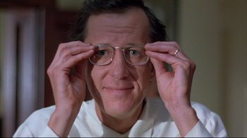 Movie still from “Shine” (1996), directed by Scott Hicks – A person wearing glasses; Close Up shot, Low angle