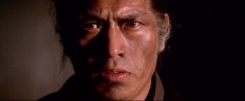 Movie still from “Shogun Assassin” (1980), directed by Kenji Misumi – A man's face in the dark; Close Up shot, Low angle