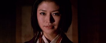 Movie still from “Shogun Assassin” (1980), directed by Kenji Misumi – A person wearing a jacket; Close Up shot, Low angle