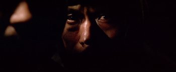 Movie still from “Shogun Assassin” (1980), directed by Kenji Misumi – A person's eyes in the dark; Extreme Close Up shot, Low angle