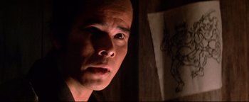 Movie still from “Shogun Assassin” (1980), directed by Kenji Misumi – A person looking at the camera; Close Up shot, Low angle