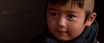 Movie still from “Shogun Assassin” (1980), directed by Kenji Misumi – A child's face in a dark room; Extreme Close Up shot, High angle