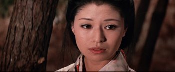 Movie still from “Shogun Assassin” (1980), directed by Kenji Misumi – A person wearing a white shirt; Close Up shot, High angle