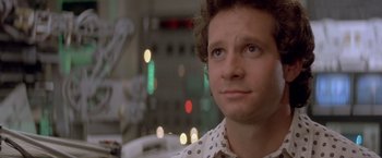 Movie still from “Short Circuit” (1986), directed by John Badham – A person looking up at the sky; Close Up shot, Low angle