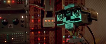 Movie still from “Short Circuit” (1986), directed by John Badham – The head of a robot; Extreme Close Up shot, Low angle