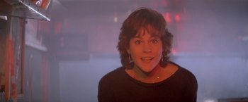 Movie still from “Short Circuit” (1986), directed by John Badham – A person smiling at the camera; Close Up shot, Low angle