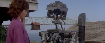 Movie still from “Short Circuit” (1986), directed by John Badham – The head of a robot; Medium shot, Low angle