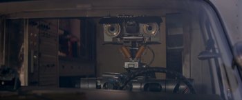 Movie still from “Short Circuit” (1986), directed by John Badham – The head of a robot; Close Up shot, Overhead angle
