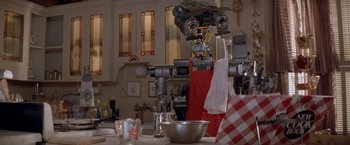 Movie still from “Short Circuit” (1986), directed by John Badham – A kitchen with a mixer and a bowl on the counter; Medium shot, Low angle
