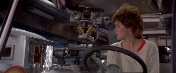 Movie still from “Short Circuit” (1986), directed by John Badham – A person in a car looking at a robot head; Close Up shot, Low angle
