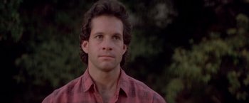 Movie still from “Short Circuit” (1986), directed by John Badham – A person wearing a plaid shirt; Close Up shot, Low angle