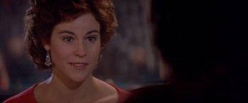 Movie still from “Short Circuit” (1986), directed by John Badham – A person with short curly hair; Close Up shot, Over the shoulder angle