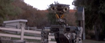 Movie still from “Short Circuit” (1986), directed by John Badham – The head of a robot; Close Up shot, Low angle