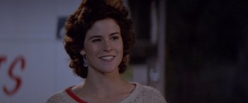 Movie still from “Short Circuit” (1986), directed by John Badham – A person wearing a sweater; Close Up shot, Over the shoulder angle