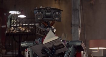 Movie still from “Short Circuit 2” (1988), directed by Kenneth Johnson – A camera on a bicycle; Close Up shot, Low angle