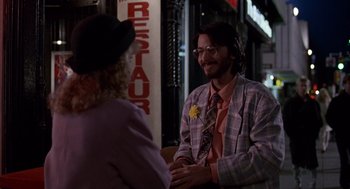 Movie still from “Short Circuit 2” (1988), directed by Kenneth Johnson – A man and a woman talking to each other outside; Medium shot, Over the shoulder angle