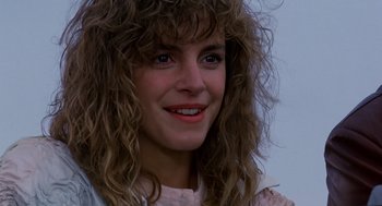 Movie still from “Short Circuit 2” (1988), directed by Kenneth Johnson – A person wearing a wig; Close Up shot, Low angle