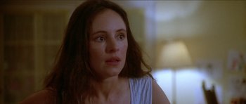Movie still from “Short Cuts” (1993), directed by Robert Altman – A person with long brown hair; Close Up shot, Over the shoulder angle