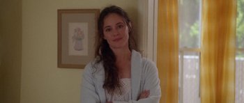 Movie still from “Short Cuts” (1993), directed by Robert Altman – A woman standing in a room with her arms crossed; Close Up shot, Over the shoulder angle