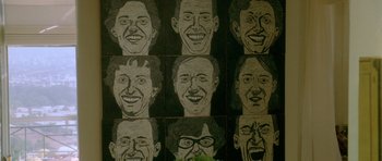Movie still from “Short Cuts” (1993), directed by Robert Altman – A bunch of faces that are on a wall; Extreme Close Up shot, Overhead angle
