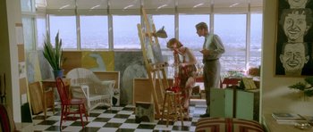 Movie still from “Short Cuts” (1993), directed by Robert Altman – A man and a woman painting in an art studio; Wide shot, High angle