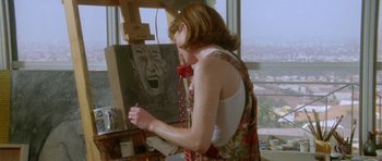 Movie still from “Short Cuts” (1993), directed by Robert Altman – A woman is painting a picture on a easel; Close Up shot, Low angle