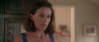 Movie still from “Short Cuts” (1993), directed by Robert Altman – A person wearing a blue shirt; Close Up shot, Over the shoulder angle