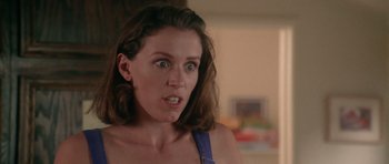 Movie still from “Short Cuts” (1993), directed by Robert Altman – A person with a surprised look on their face; Close Up shot, Low angle