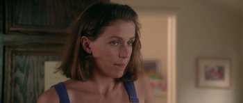 Movie still from “Short Cuts” (1993), directed by Robert Altman – A person wearing a blue shirt; Close Up shot, Over the shoulder angle