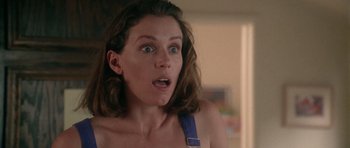 Movie still from “Short Cuts” (1993), directed by Robert Altman – A person wearing a bra; Close Up shot, Low angle