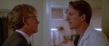 Movie still from “Short Cuts” (1993), directed by Robert Altman – Two people talking to each other in a room; Close Up shot, Over the shoulder angle