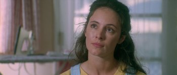 Movie still from “Short Cuts” (1993), directed by Robert Altman – A person with long dark hair; Close Up shot, Over the shoulder angle