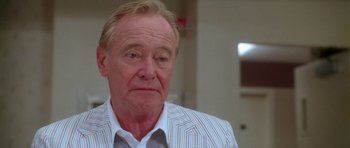 Movie still from “Short Cuts” (1993), directed by Robert Altman – An older man in a white shirt and striped shirt; Close Up shot, Low angle