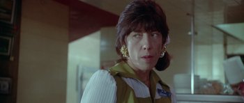 Movie still from “Short Cuts” (1993), directed by Robert Altman – A person wearing a jacket; Close Up shot, Low angle