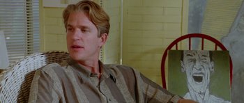 Movie still from “Short Cuts” (1993), directed by Robert Altman – A person sitting in a chair; Close Up shot, Over the shoulder angle
