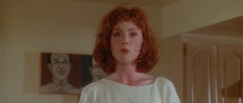 Movie still from “Short Cuts” (1993), directed by Robert Altman – A person wearing a white shirt; Close Up shot, Low angle