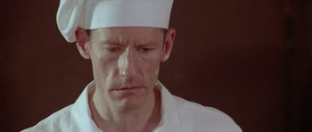 Movie still from “Short Cuts” (1993), directed by Robert Altman – A person wearing a hat; Close Up shot, Low angle