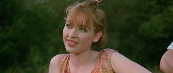 Movie still from “Short Cuts” (1993), directed by Robert Altman – A person wearing a dress; Close Up shot, Over the shoulder angle