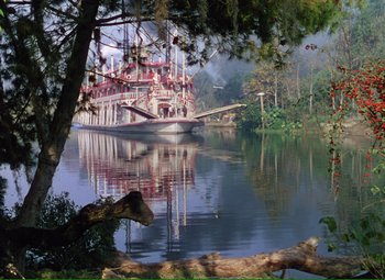 Movie still from “Show Boat” (1951), directed by George Sidney – A boat in the water near a bridge; Extreme Wide shot, High angle