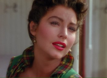 Movie still from “Show Boat” (1951), directed by George Sidney – A person wearing a plaid shirt; Close Up shot, Over the shoulder angle