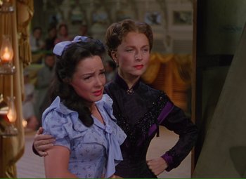 Movie still from “Show Boat” (1951), directed by George Sidney – Two beautiful women standing next to each other; Medium shot, Over the shoulder angle