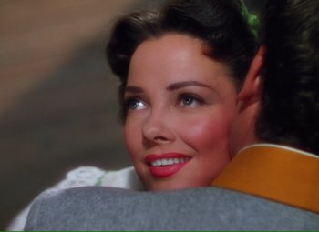 Movie still from “Show Boat” (1951), directed by George Sidney – A woman's face with red lipstick; Close Up shot, Over the shoulder angle