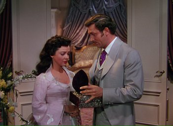 Movie still from “Show Boat” (1951), directed by George Sidney – A man and a woman looking at each other in a room; Medium shot, High angle