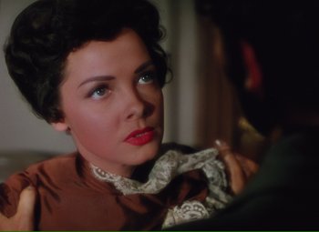 Movie still from “Show Boat” (1951), directed by George Sidney – A person wearing a necktie; Close Up shot, Over the shoulder angle